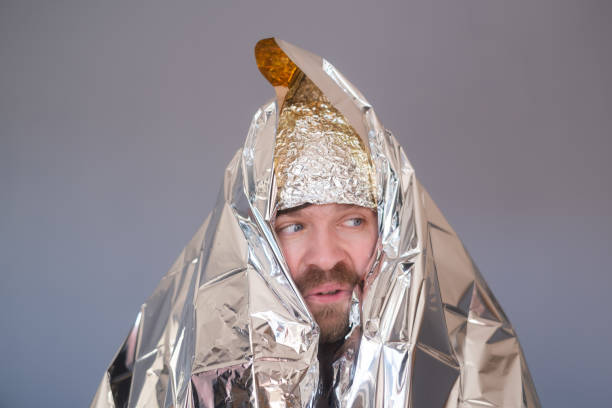 istock Lost hiker wrapped in an emergency survival blanket 1408643921
