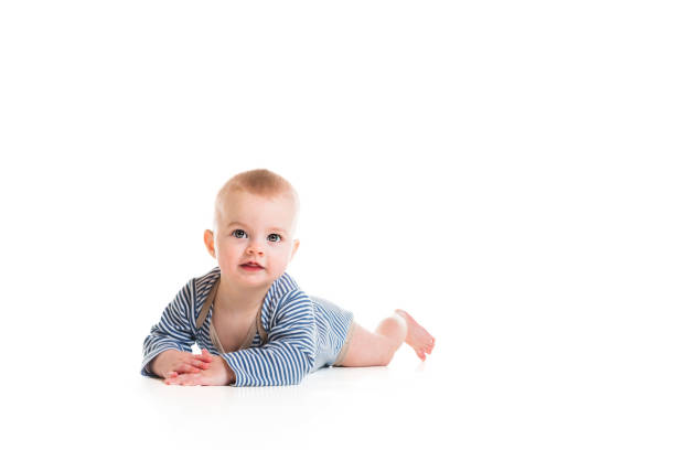 istock Cheerful baby boy toddler on white studio background 1408645557