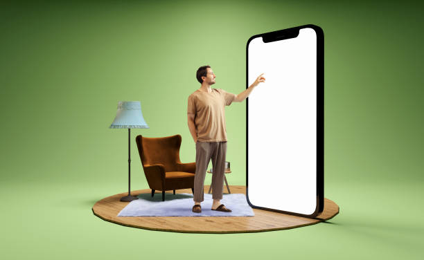 foto e ilustração 3d do homem ao lado do enorme modelo 3d do smartphone com tela branca vazia isolada em fundo verde. mockup para anúncio - ecrã grande - fotografias e filmes do acervo