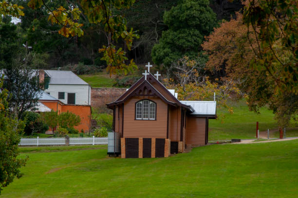 istock Church or chapel in village surrounded by lawn 1408654097