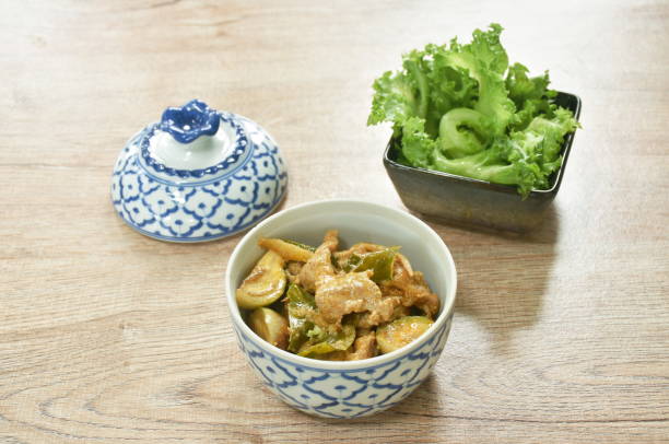 boiled pork with eggplant in coconut milk curry and fresh lettuce boiled pork with eggplant in coconut milk curry and fresh lettuce in bowl Cup of Lettuce stock pictures, royalty-free photos & images