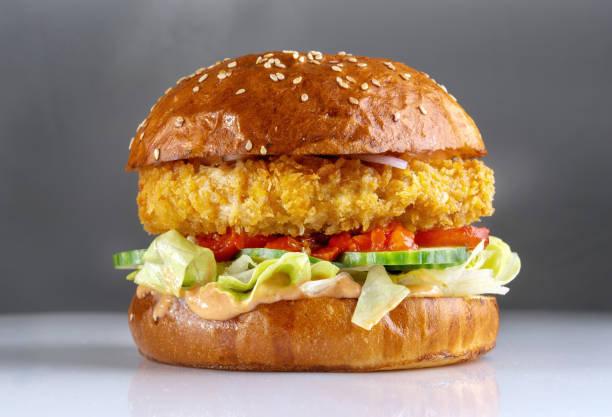 istock Shrimp burger, a cutlet made with minced shrimp. With cheese, tomatoes and sesame seed bun. 1408654811