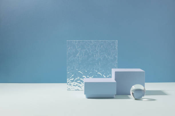 istock Abstract creative geometric podium from various materials, blue background hard shadows. Minimalism 1408656040