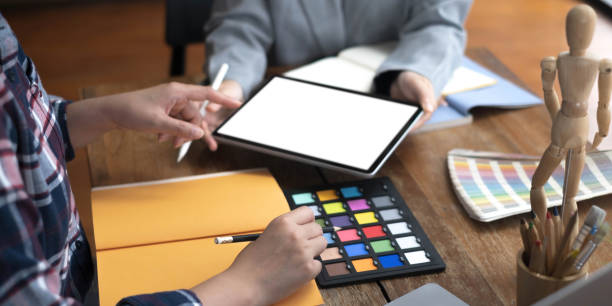 istock Two artists working on tablet, colour paper tone on workspace at the office 1408656992