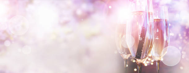 Champagne on pink background Wedding champagne on tender pink bokeh background. Horizontal close-up for a wedding concept with space for text. sysmbolic stock pictures, royalty-free photos & images
