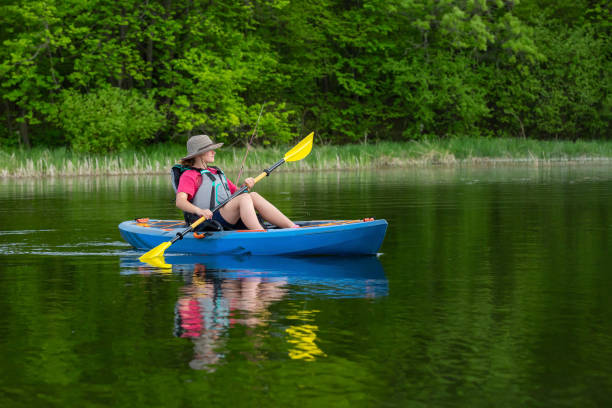 istock Girl Kayaking on Lake On Summer Day 1408659545