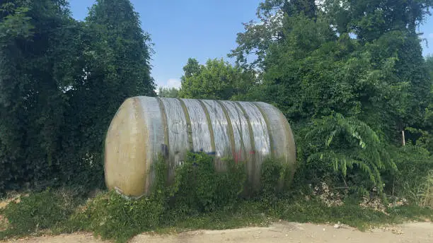 Abandoned watertank covered in plants nature prevails