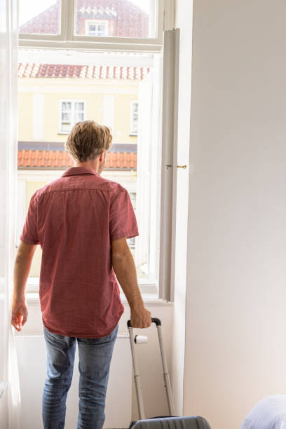 istock Young man checking in hotel room 1408660177