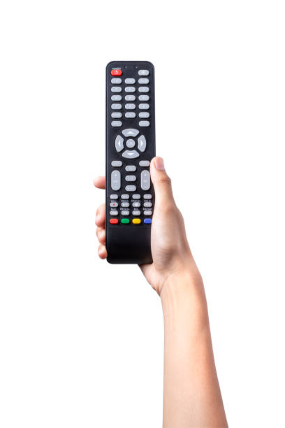 istock Woman hand holding TV remote control with clipping path isolated on white background. 1408666068