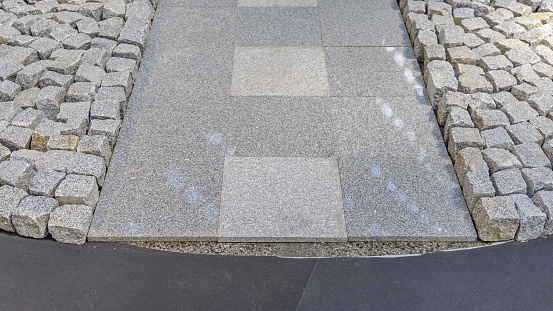 Glossy Grey Tiles and Cobblestones Granite Material Construction Site