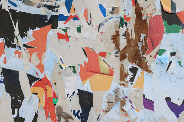 istock Pieces of torn paper peeling off wall used as billboard 1408670082