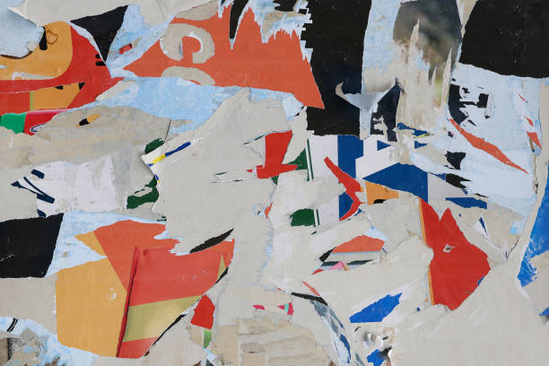 istock Pieces of torn paper peeling off wall used as billboard 1408670282