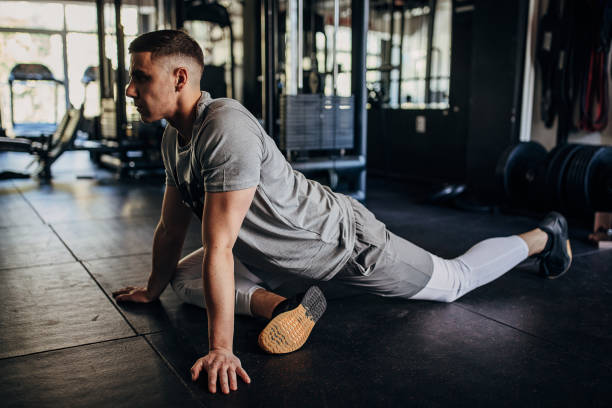 istock Man exercising in gym 1408670569