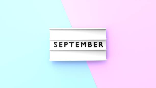 istock September Text is Displaying on a Lightbox on Blue and Pink Background 1408671073