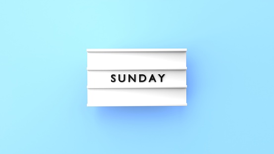 Sunday text is displaying on a vintage letter board lightbox against blue background. Easy to crop for all your social media and print sizes.