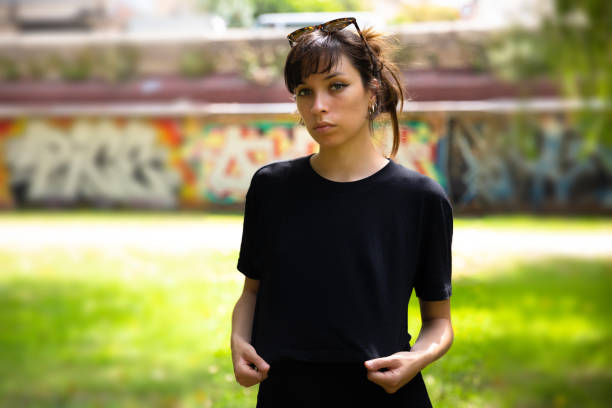 Young woman wearing black t-shirt stock photo
