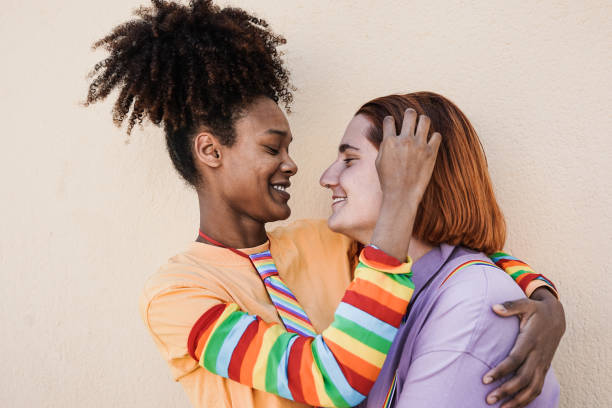 istock Multiracial lesbian women having tender moment at LGBT pride parade 1408674573