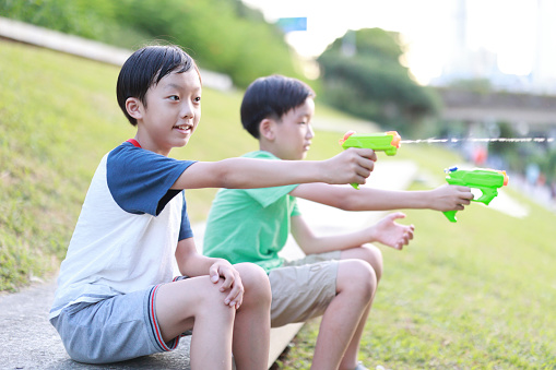 Children playing with squirt gun