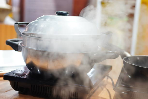 istock Pressure cooker releasing hot steam 1408676789