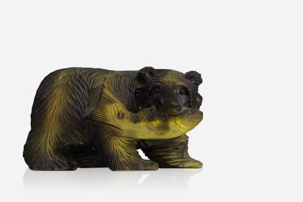 istock inside left, old wooden and yellow bear with fish on white background, object, decor, vintage, fashion, copy space 1408678736