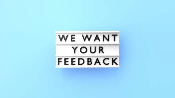 We Want Your Feedback text is displaying on a vintage letter board lightbox against blue background. Easy to crop for all your social media and print sizes.