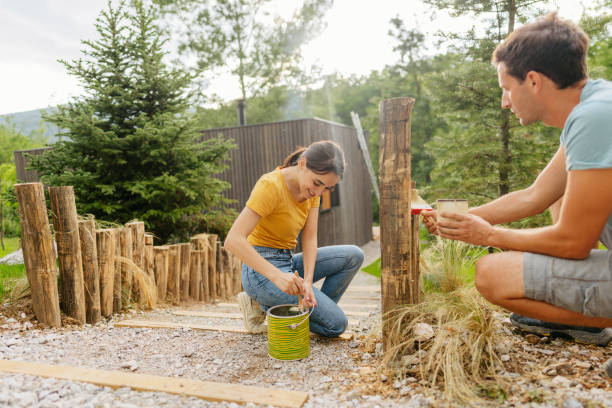 istock Painting together a wooden path fence 1408682302