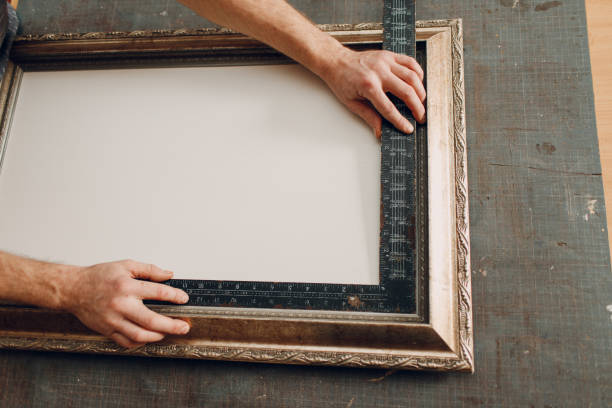 Restoration, measurement, renewal picture frame for museum painting art picture. Painting baguette handmade picture frame at studio. Restoration, measurement, renewal picture frame for museum painting art picture. Painting baguette handmade picture frame hand cropping photos stock pictures, royalty-free photos & images