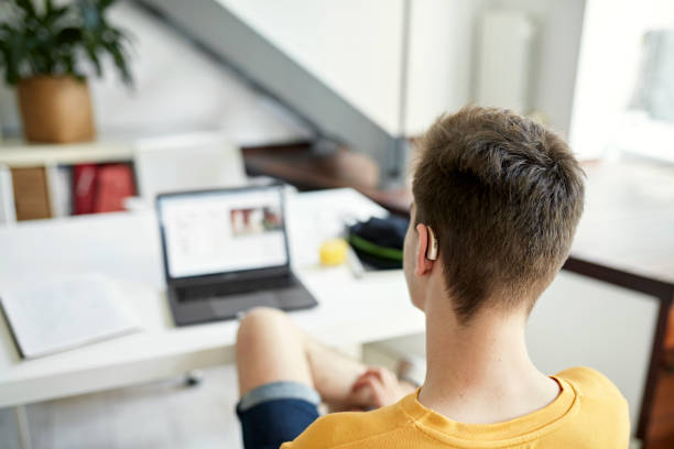istock Deaf teenage student doing homework 1408686753