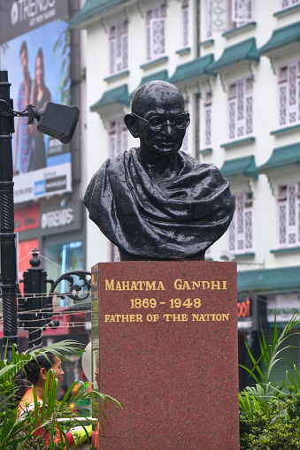 Gangtok, India - June 21, 2022: Gangtok, India - June 21, 2022: Mahatma Gandhi Statue in the busy MG Marg street at Morning.