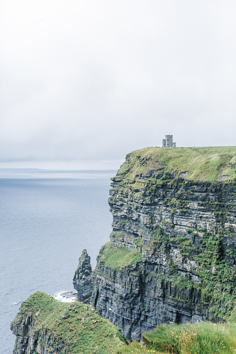 O'Brien Tower at the Cliffs of Moher on a cloudy day in Lahinch, County Clare, Ireland