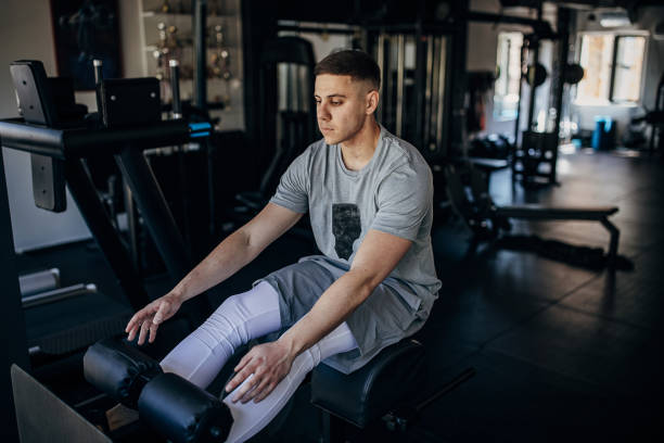 istock Man exercising in gym 1408690644