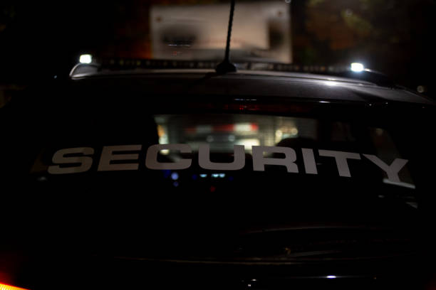istock Security car patroling at construction site at night  city 1408694372