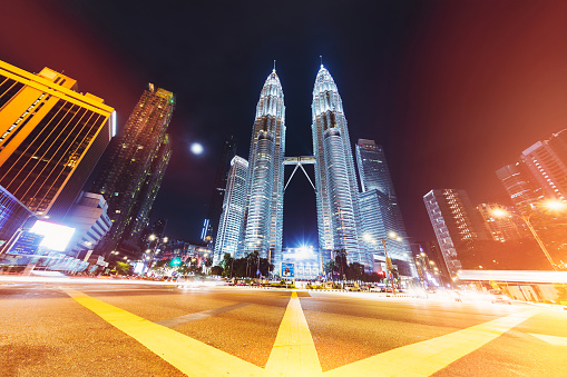View of famous Twin Towers from a busy road intersection - Kuala Lumpur, Malaysia