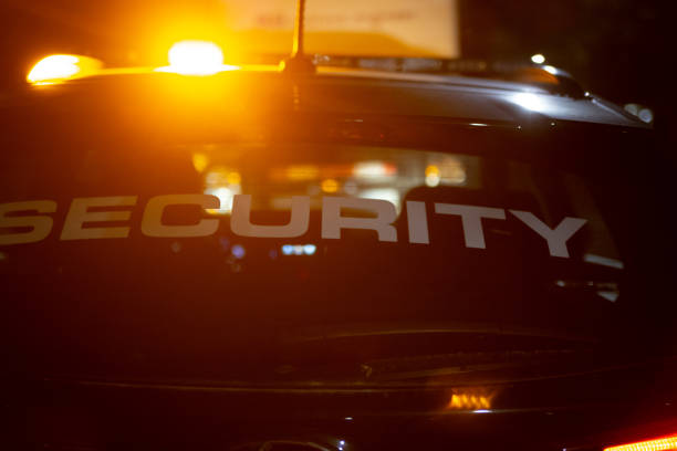 istock Security car patroling at construction site at night  city 1408696281