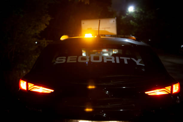 istock Security car patroling at construction site at night  city 1408696282