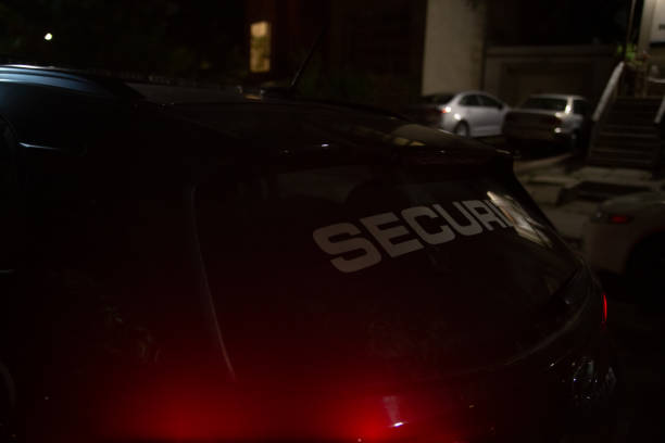 istock Security car patroling at construction site at night  city 1408696454