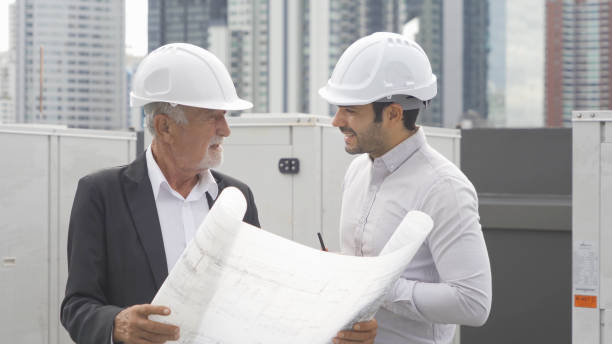 istock Engineer men or worker team, people working in industry factory. Chiller tower on rooftop building. System work machine. Condenser Water Supply pipe lines. Ventilation compressor 1408699746