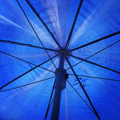 Blue umbrella and umbrella