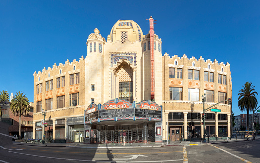 Oakland, USA - May 19, 2022: The morning sun rises on the iconic Fox Oakland Theatre, a concert hall and former movie theater in Downtown Oakland.