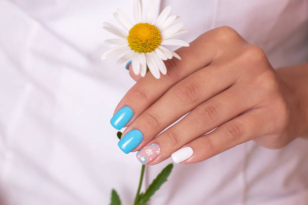 istock Female hands with summer manicure nails 1408705714