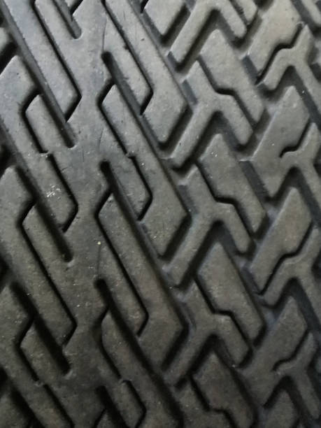 istock Car tire close-up with tire tread pattern. Close-up. Abstract background 1408705829