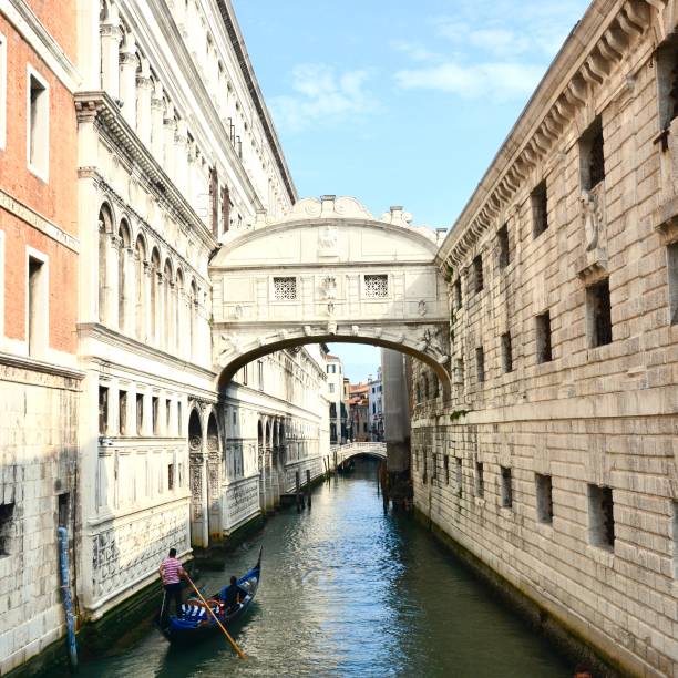 Venice, Veneto, Italy - 10/09/2020: One of the most famous bridges of Venice with gondolas navigating in it