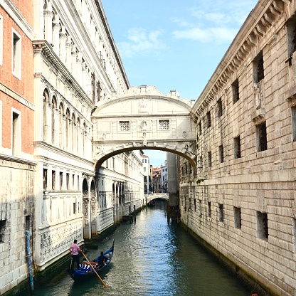 Gondola traveling under the bridge of sighs, Venice, Italy