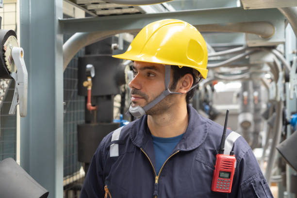 istock An engineer man or worker, people working in industry factory. Chiller tower on rooftop building. System work machine. Condenser Water Supply pipe lines. Ventilation compressor. Workshop site. 1408707894