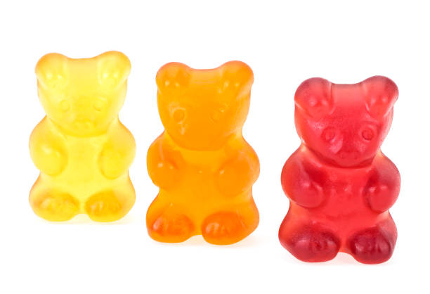 istock Colourful sweet gummy bears isolated on a white background. Three marmalade bears. 1408709502