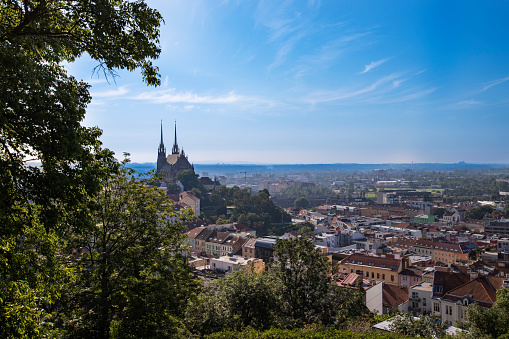 A view of the city of Brno in the Czech Republic in Europe from the viewpoint of pilberk. The dominant feature of Brno is the Cathedral of St. Peter - Petrov. In the background is a blue sky with clouds.