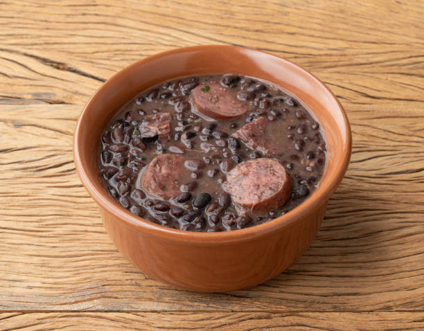 istock Traditional brazilian feijoada in a bowl over wooden table 1408716548
