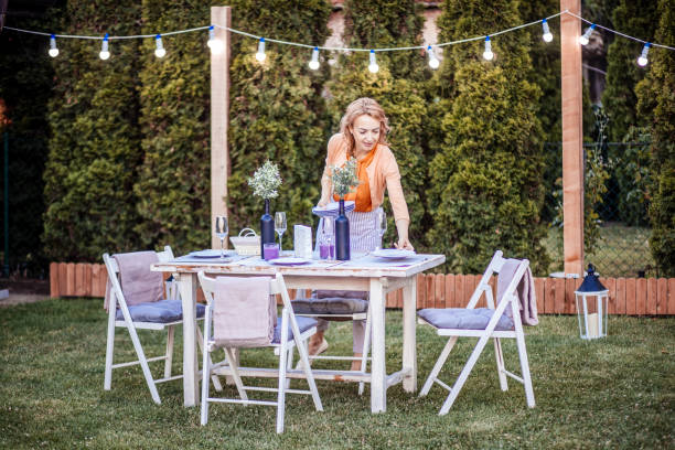 istock Woman serving outdoor party table 1408721006