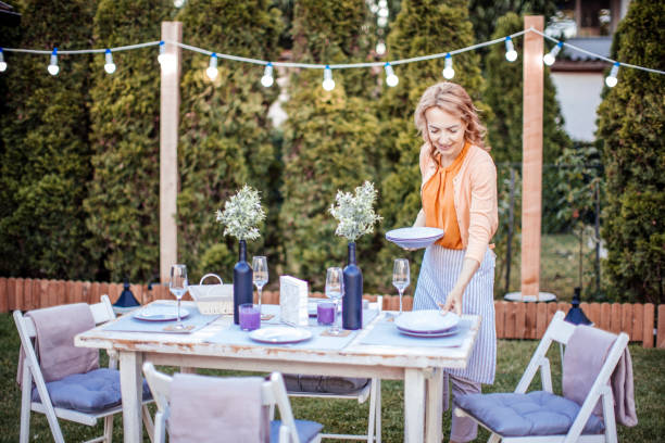 istock Woman serving outdoor party table 1408721009