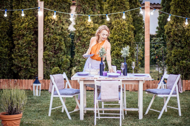 istock Woman serving outdoor party table 1408721014